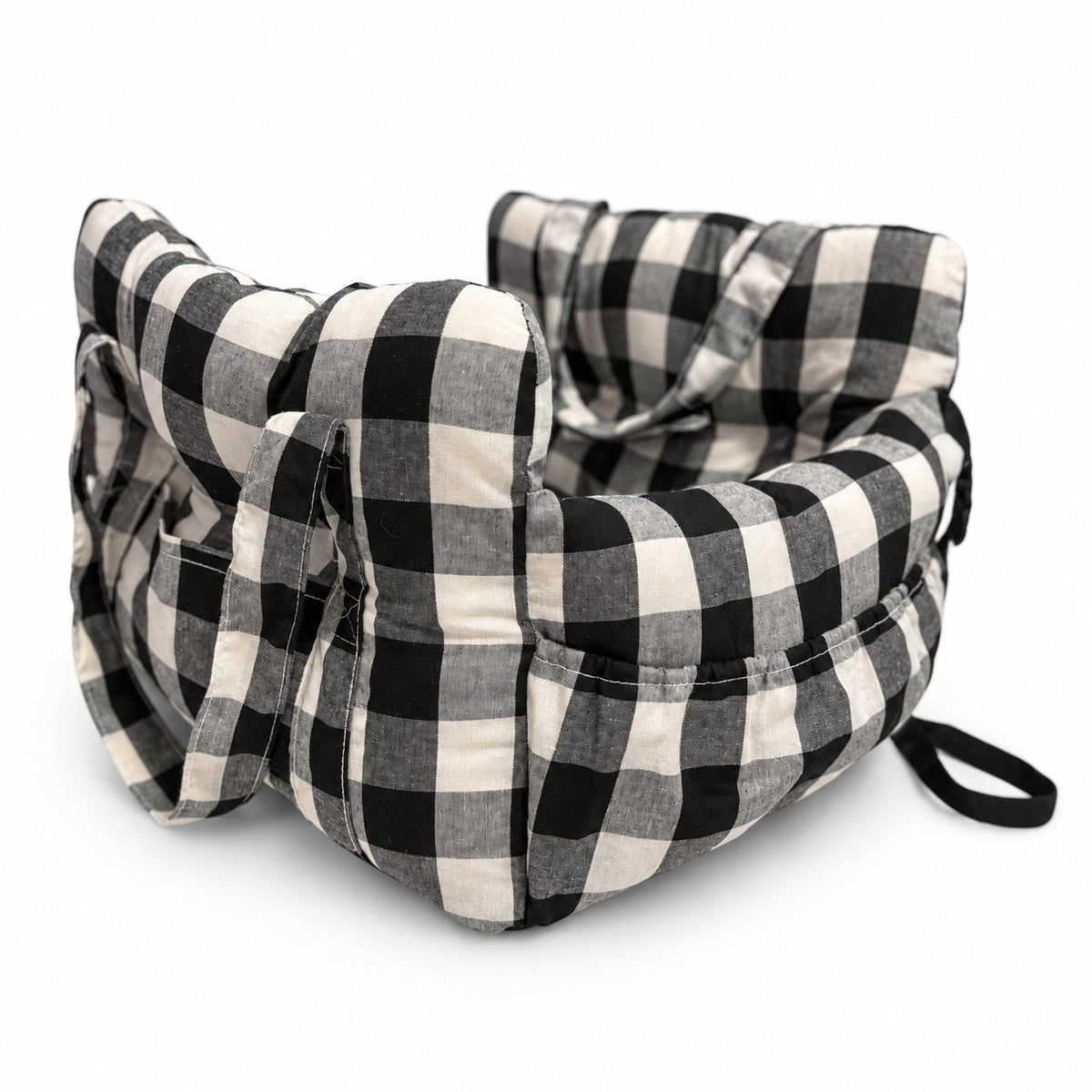 Pet car bed in black check on a white background, with carry handles and side pockets