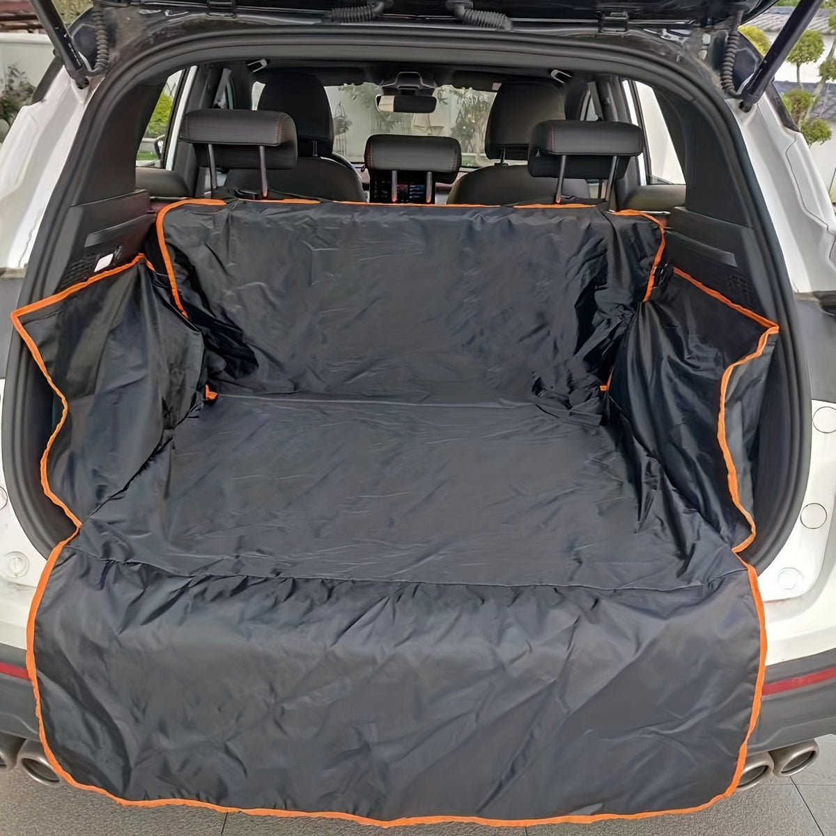 Cargo liner installed in an SUV with side flaps up and the bumper flap down