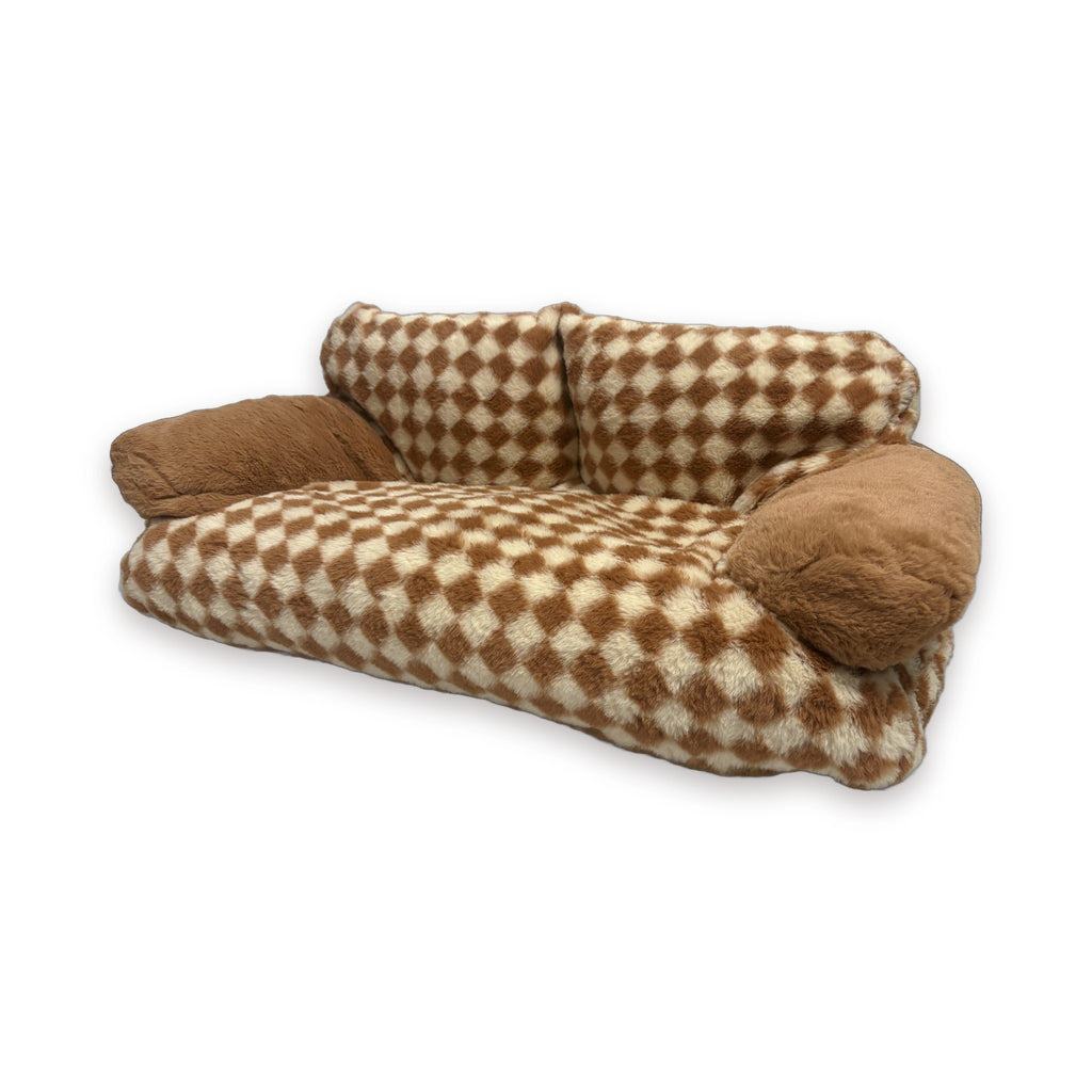 Brown checker sofa bed from a three-quarter angle showing the bolster arms