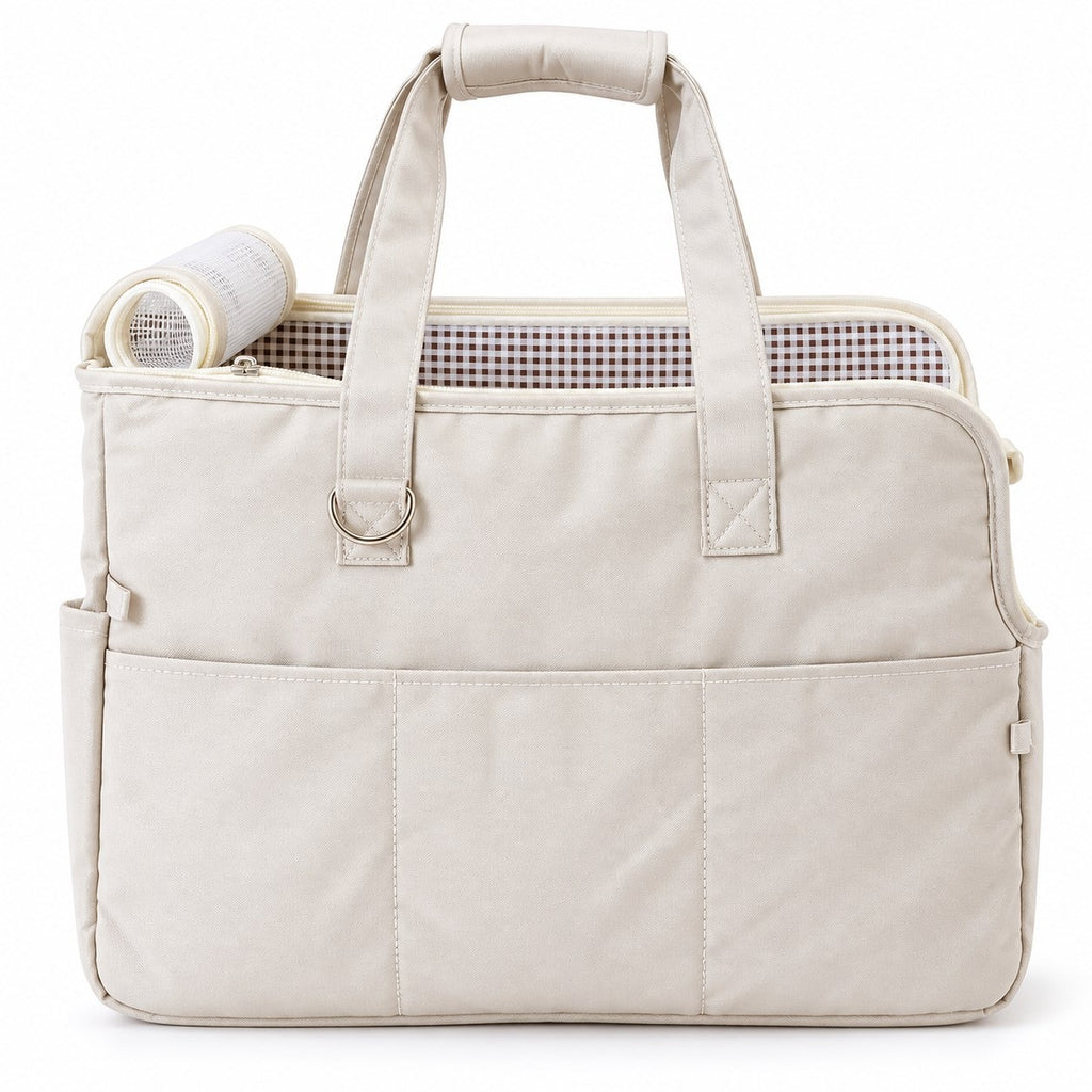 Beige pet travel tote with two handles, front pocket and checked lining on white