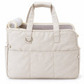 Beige pet travel tote with two handles, front pocket and checked lining on white