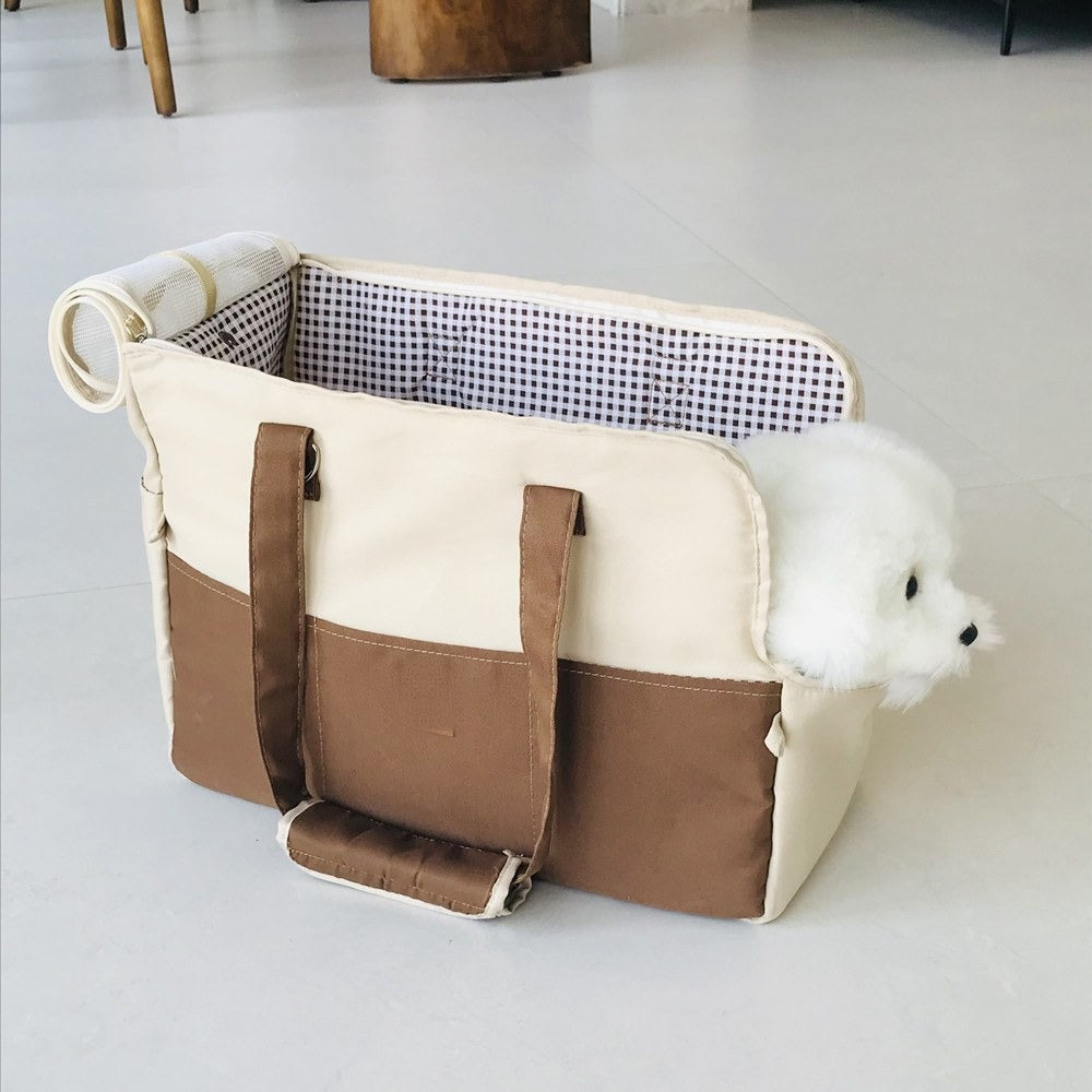 Pet travel tote in brown and cream with a checked lining